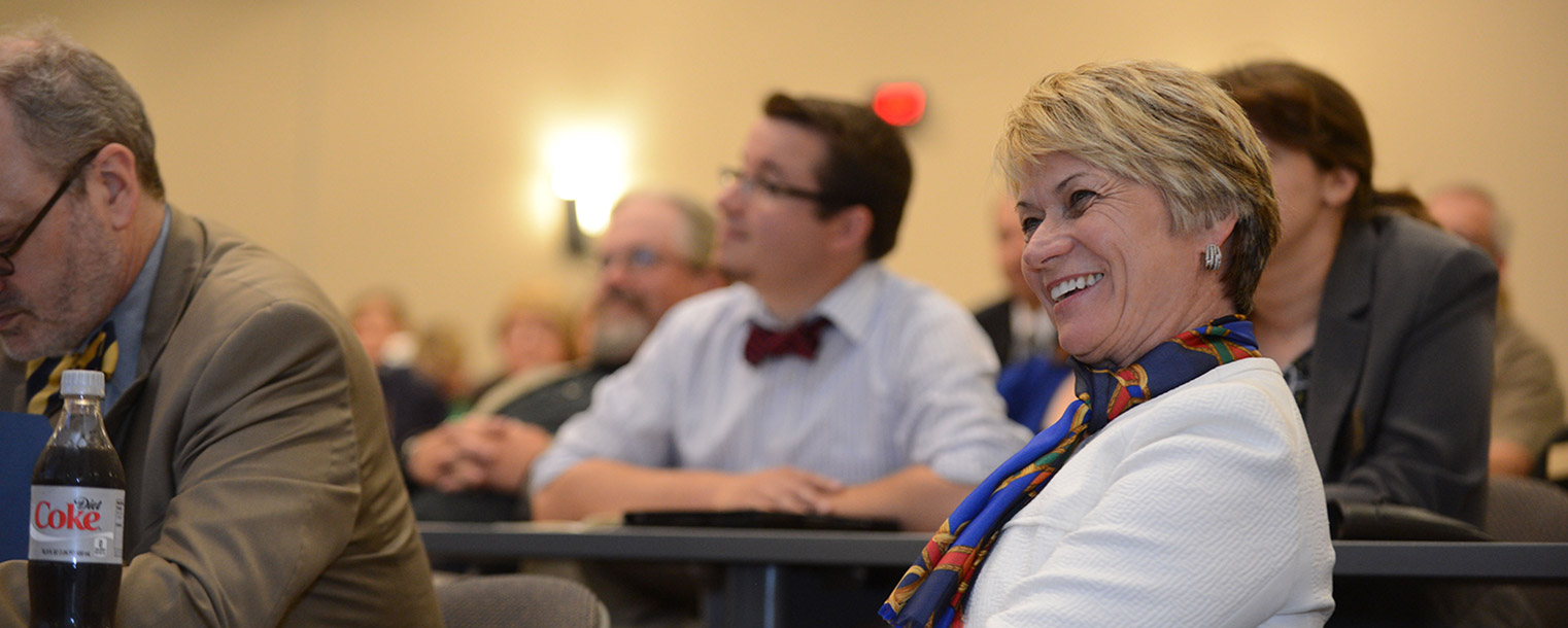 Kent State President Beverly Warren listens to a presentation about Kent State University at Ashtabula given by Dean Susan Stocker.